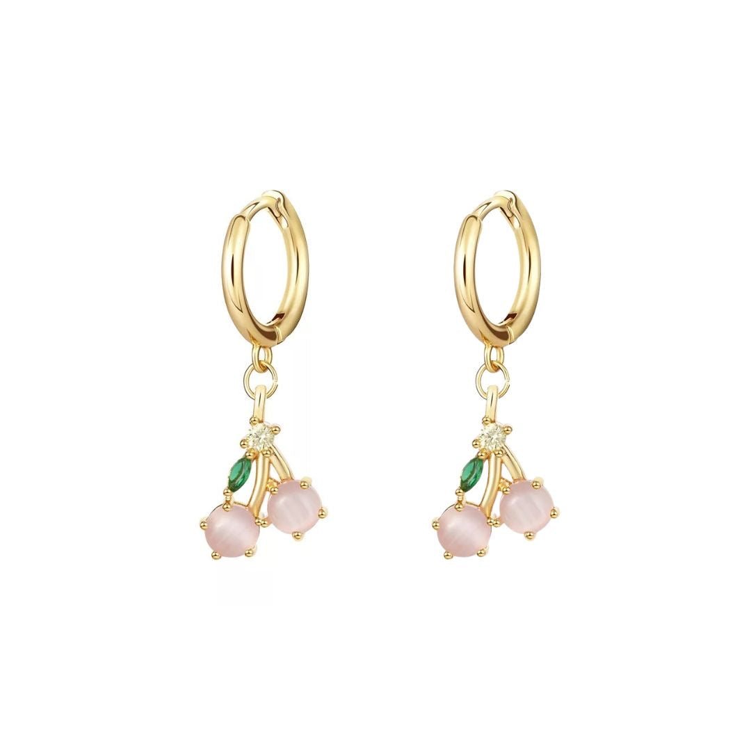 Gold hoop earrings with pink and green gemstones on a white background