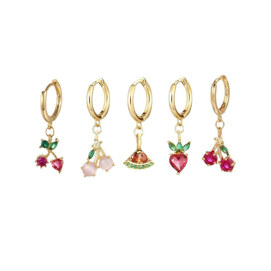 Set of five gold hoop earrings with colorful fruit charms on a white background